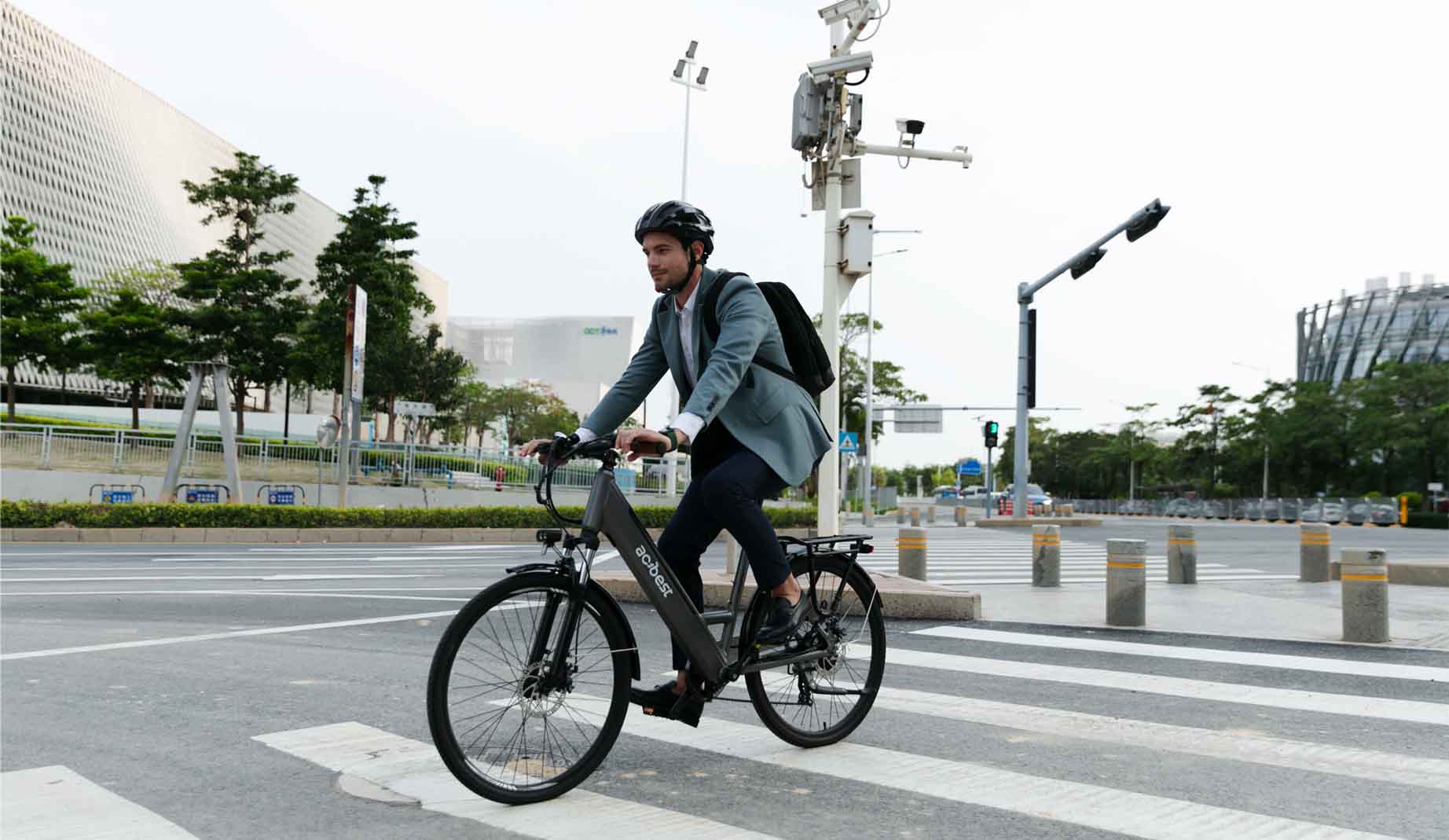 Urban cyclist on electric bike at crosswalk