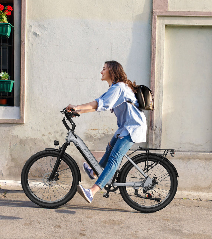 The woman is riding an electric bicycle.