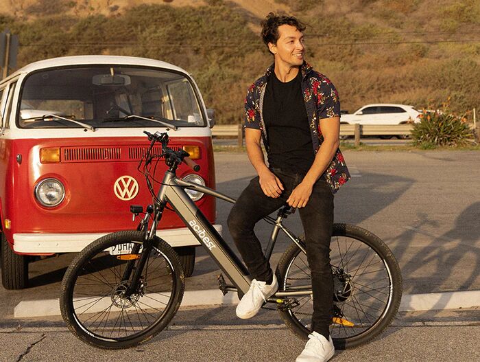 Teenagers lean against an Actbest electric bike