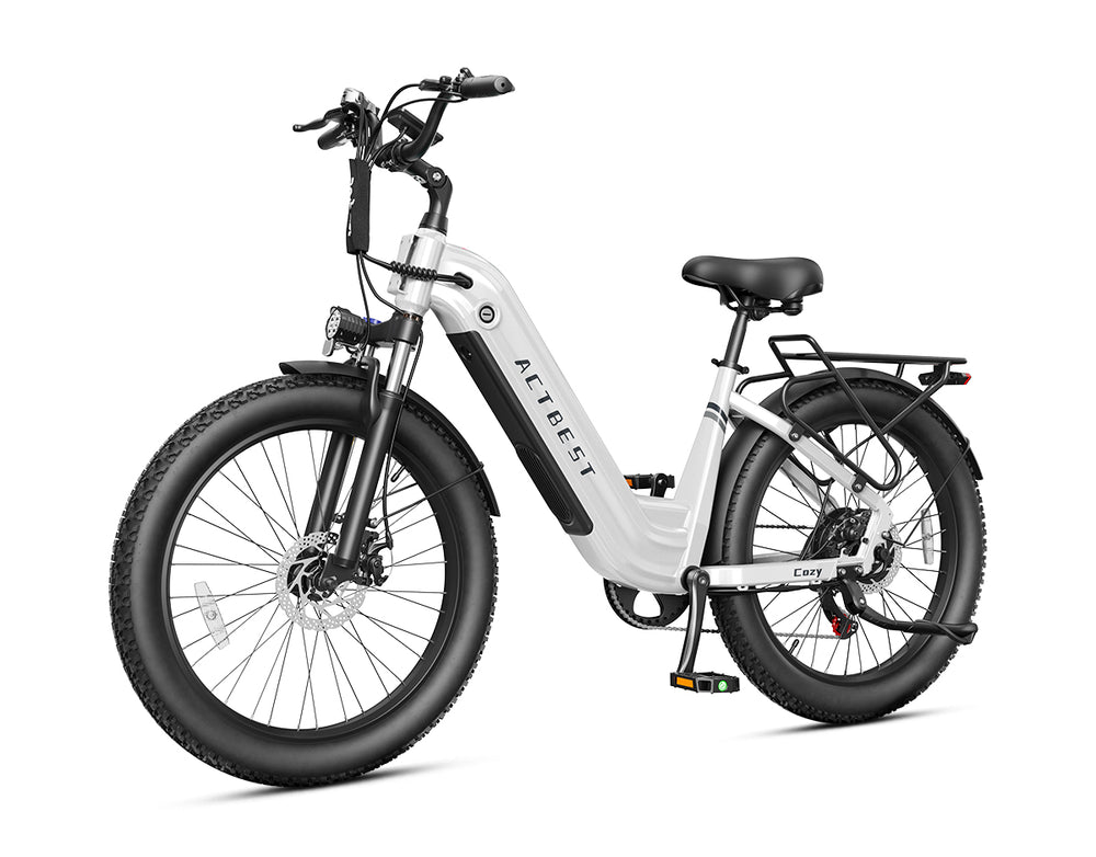 Actbest Cozy white electric commuter bike with step-through frame, fat tires, fenders, and rear cargo rack