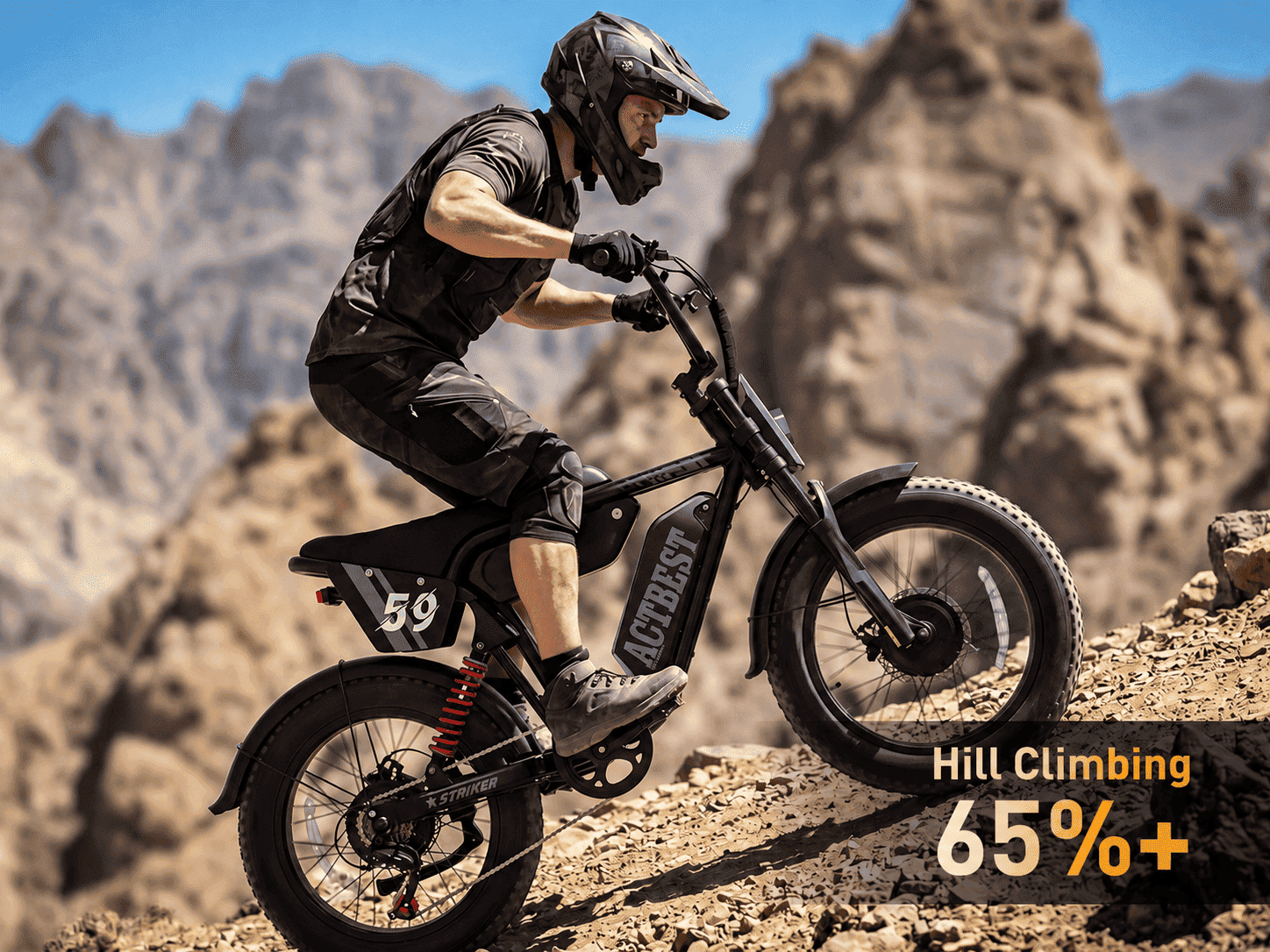 Striker Max electric bike climbing a steep rocky hill with 65%+ grade hill-climbing capability