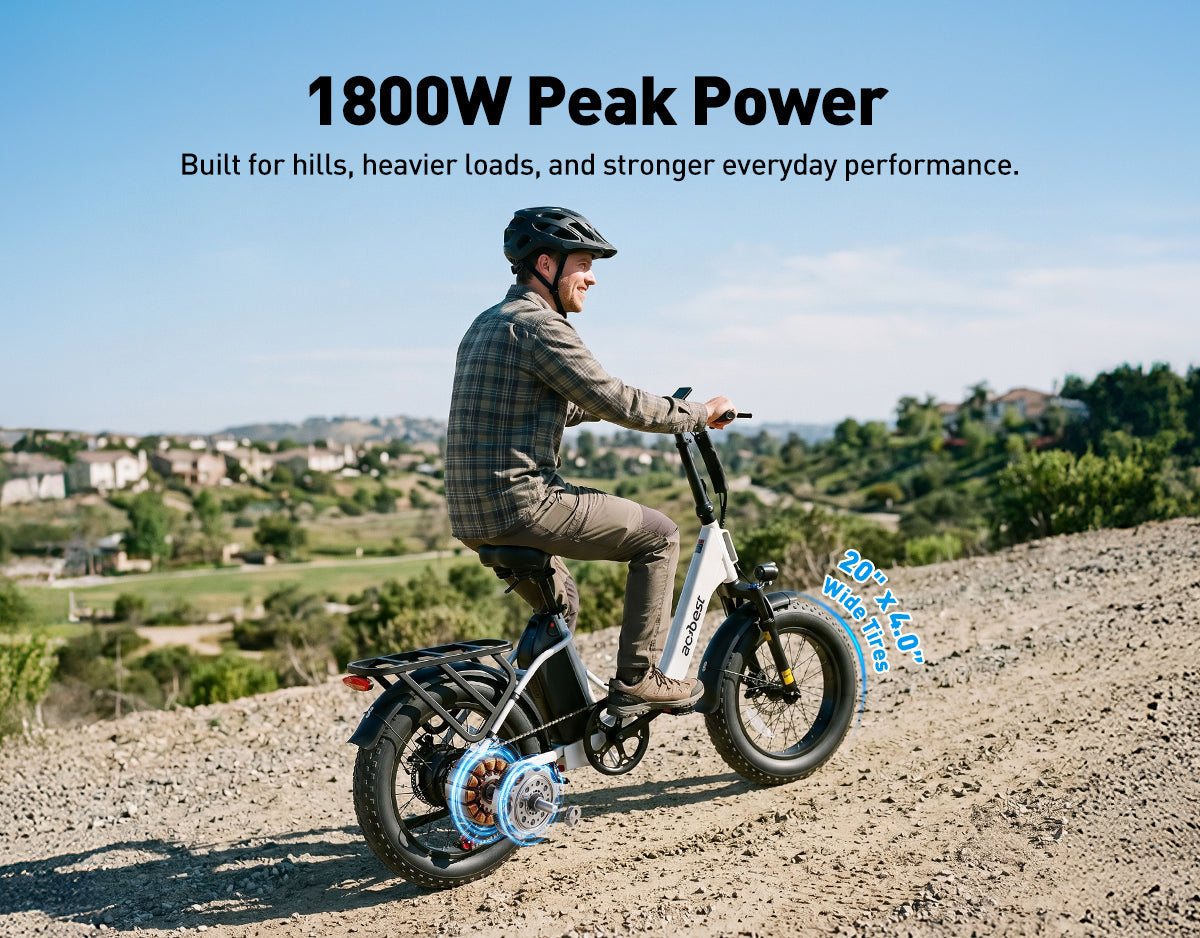 White Actbest Mars Plus ST e-bike riding up a dirt hill, showcasing the 1800W peak power motor and 20x4.0 inch wide tires built for hills