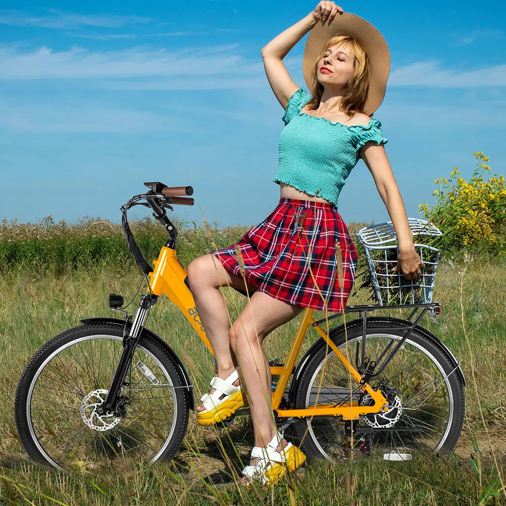 Woman with plaid skirt on yellow Actbest Step-Through Electric Bike in grassy field.