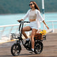 Woman joyfully riding black foldable electric bike with sunflowers basket.