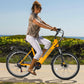 Woman riding yellow Actbest Core Step-Through Electric Bike along a beach path.