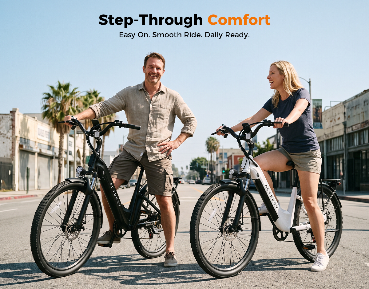 A man and a woman stand on electric bicycles on a sunny city street, with the text 'Step-Through Comfort' at the top. The man wears a beige shirt and shorts, and the woman wears a dark gray shirt and shorts.