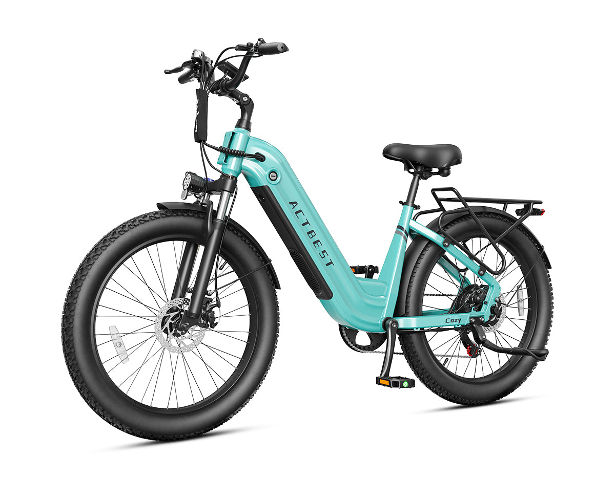 Actbest Cozy mint green electric commuter bike with step-through frame, fat tires, fenders, and rear cargo rack
