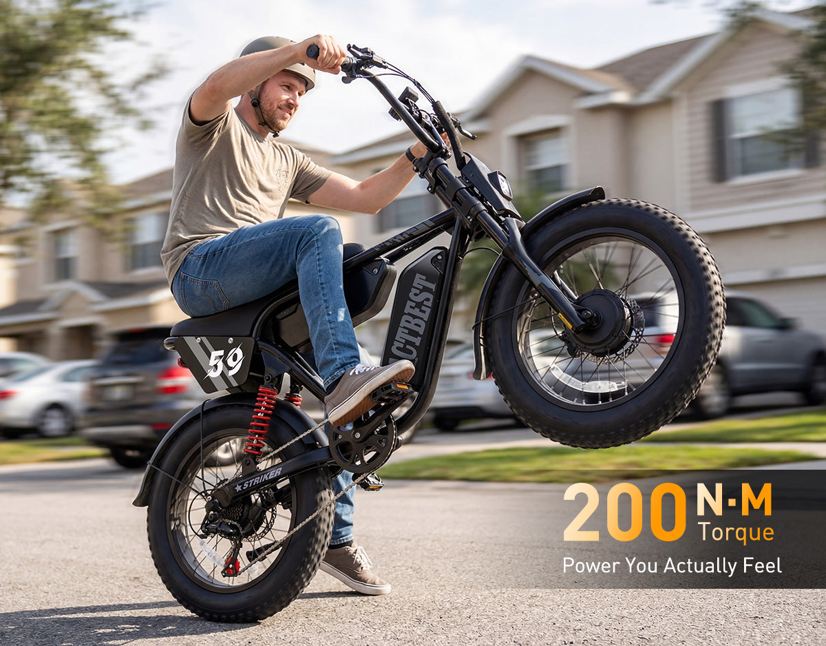 Striker Max electric bike showing 200 Nm torque with rider performing a wheelie on a neighborhood street